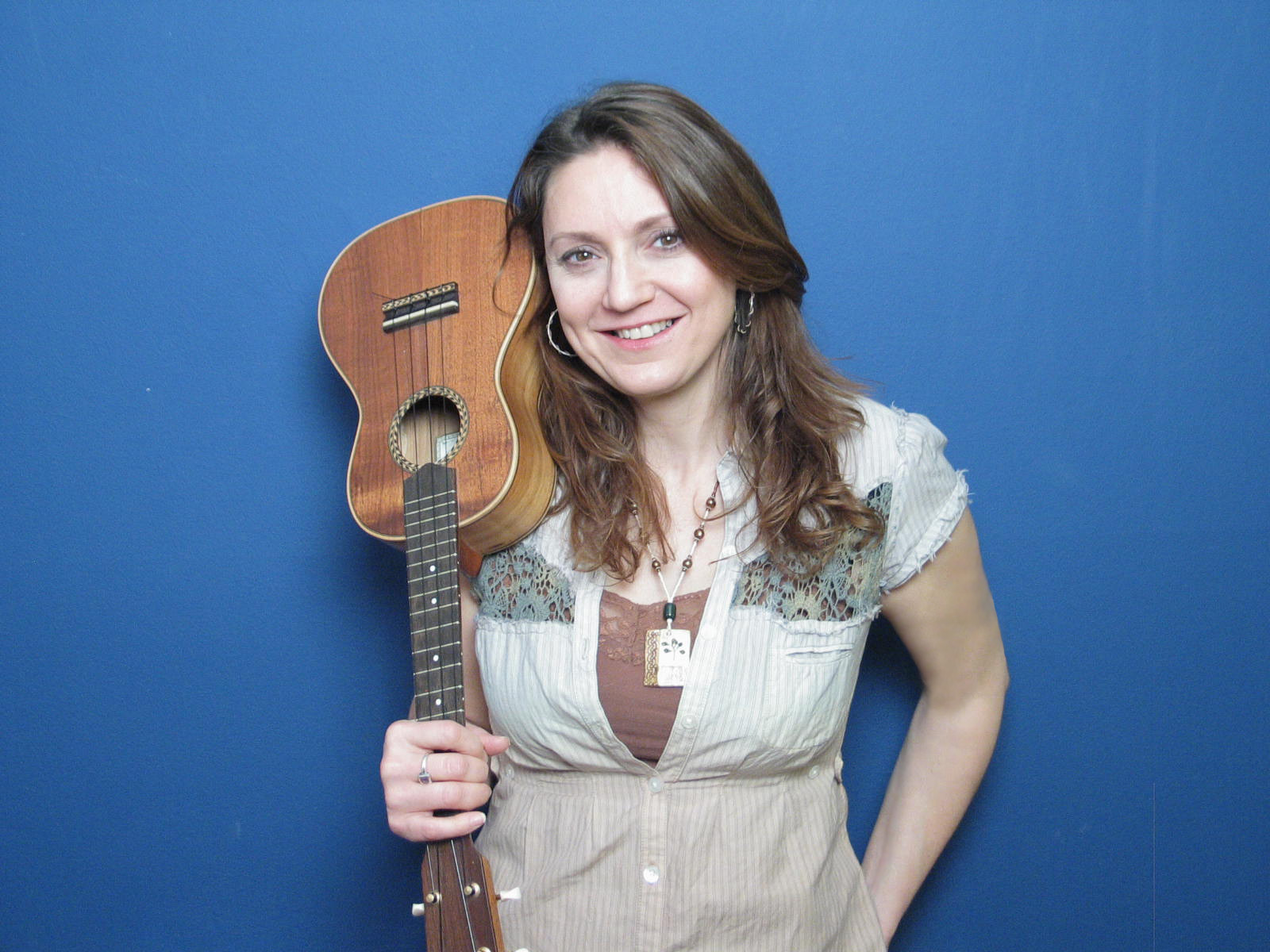 Suzanne holding a ukulele